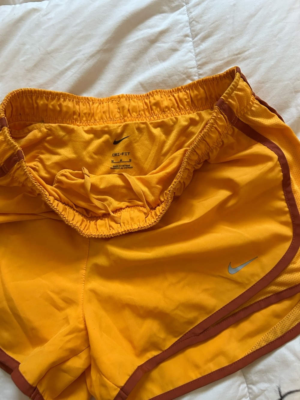 Nike Yellow Running Shorts with Rust Trim and Silver Swoosh